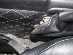 Detail of restored console, brake boot, ebrake hardware, and seat hinge and