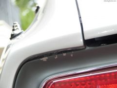 Scratched taillight finisher panel