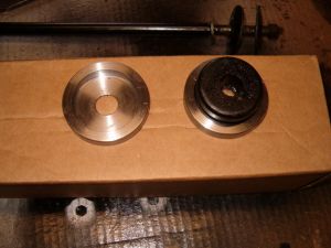 Left and right tension rod bushing retainer.