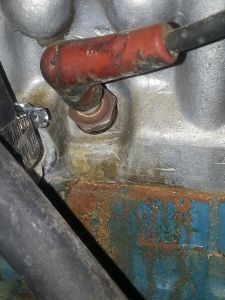 1976  280Z  Spark plug cover that had been dripped on by heater hose.