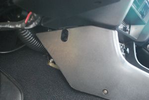 Drivers side under damage, console