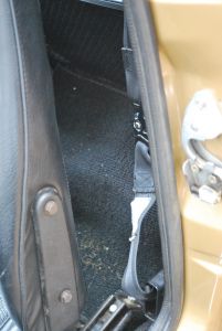 Drivers side door jamb by seat