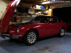 My240z Side on in the garage bonnet open