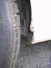 Pass. lower qtr panel damage
