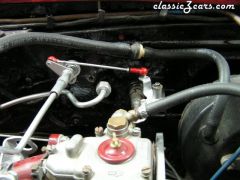 retro fitting stock throttle linkage  to triple Webers