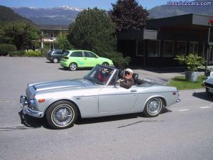 Jaap and Victor in their Fairlady, they with a camper and transporter