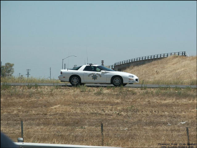 New white Camaro CHP car